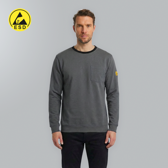 Man wearing a gray sweatshirt with a yellow logo on a gray background