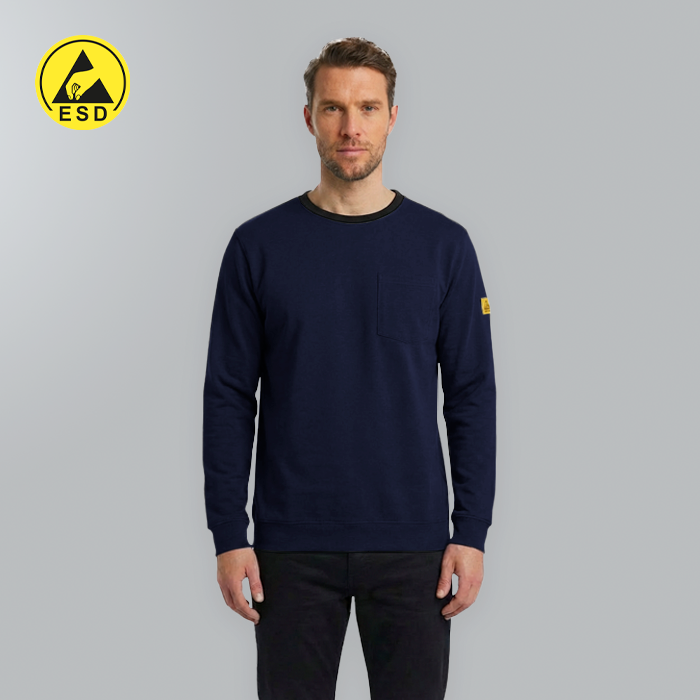 Man wearing a navy blue sweatshirt with a yellow logo on a gray background
