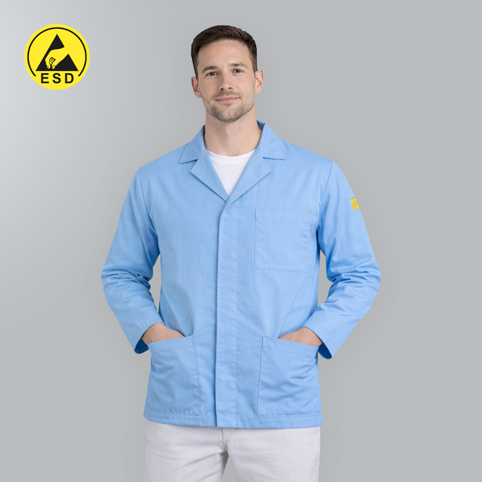 Man wearing a light blue lab coat with an ESD logo on a gray background