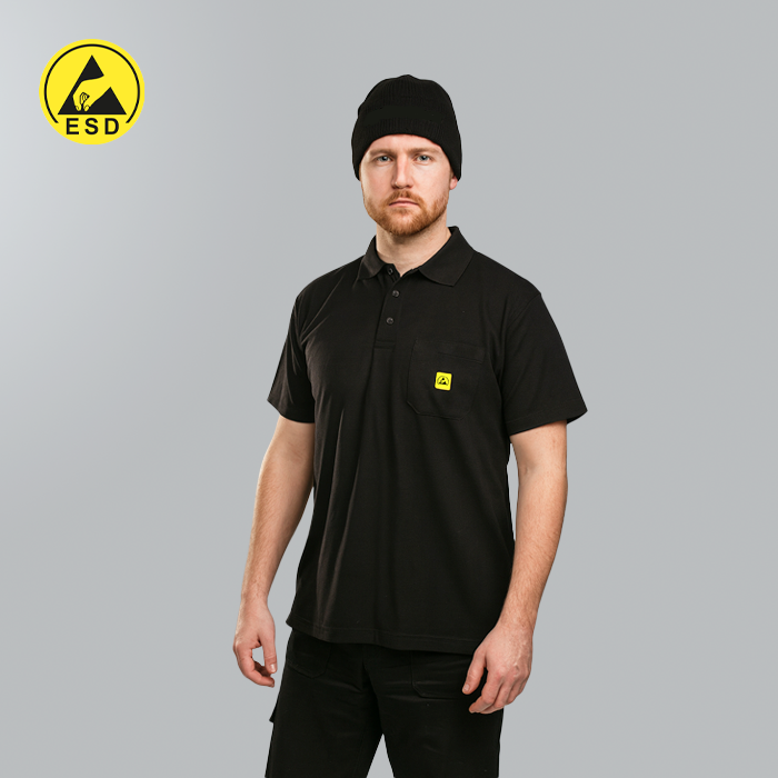 Man wearing a black polo shirt with a small logo on a gray background