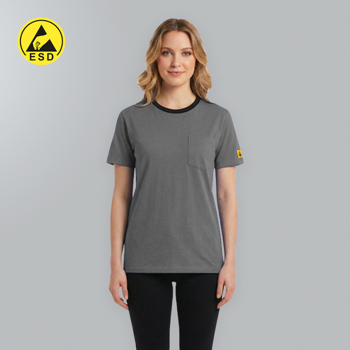 Woman wearing a gray t-shirt with a yellow logo on a gray background